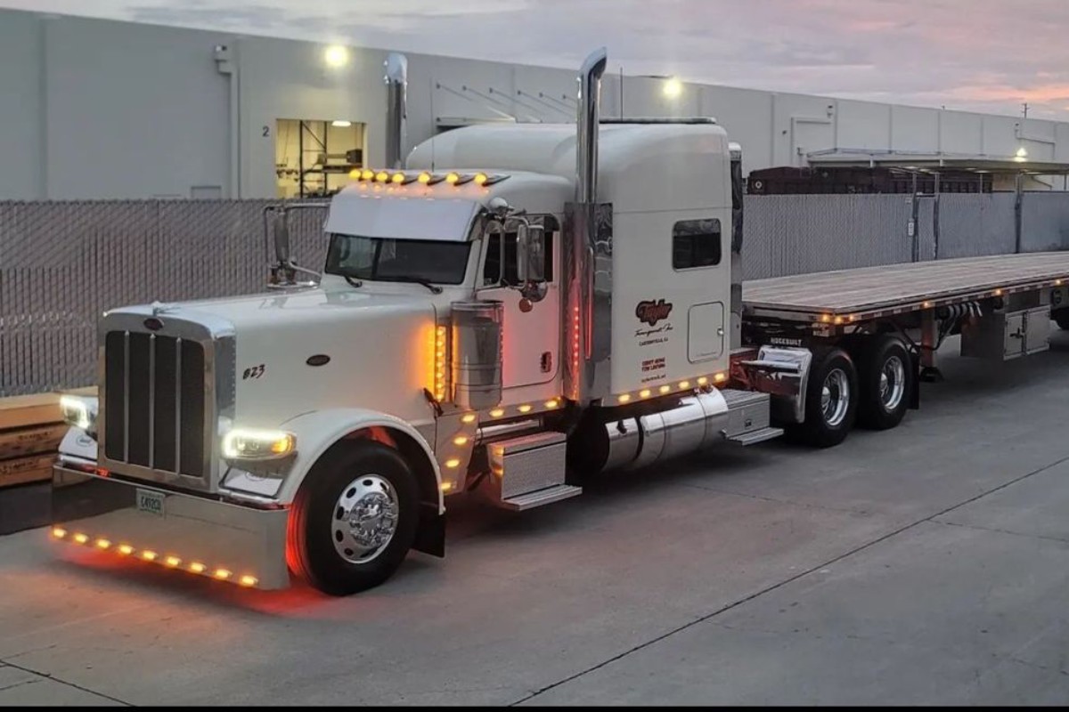 Vehicles and equipment transported on a flatbed trailer